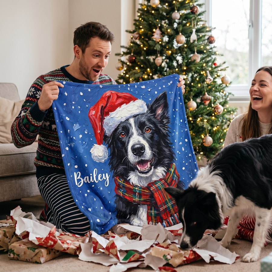 Man unwrapping a personalised Christmas border collie blanket on Christmas morning