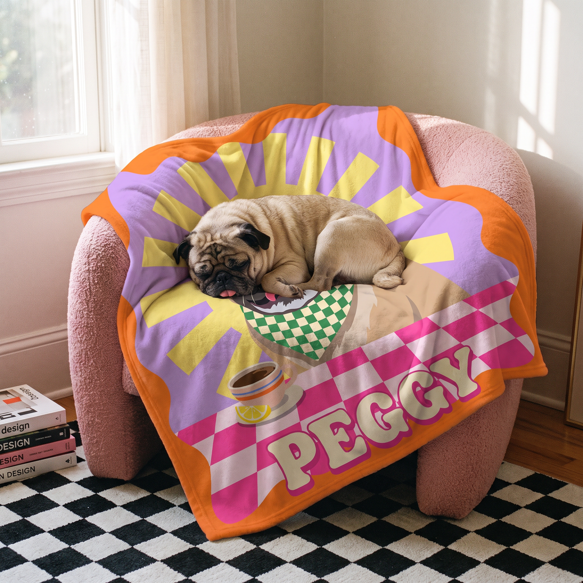 Pug asleep on its pop art portrait blanket on a pink armchair