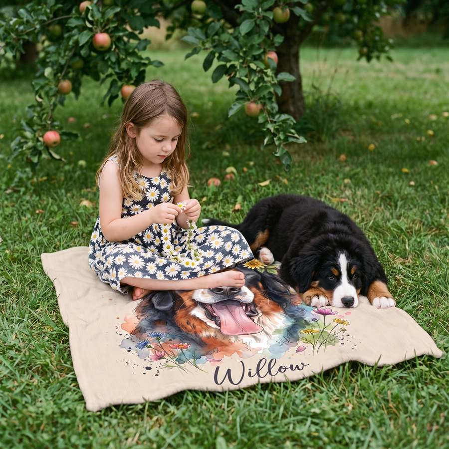 Girl making a daisy chain on a lap size flower crown blanket with her puppy