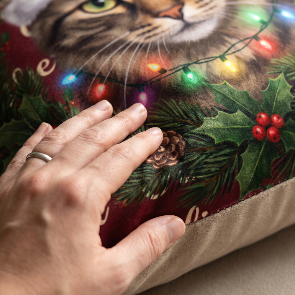 Close up of a hand on the soft-touch faux suede showing the Christmas Wreath print
