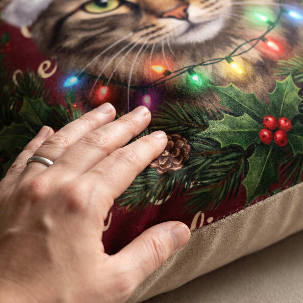 Close up of a hand on the soft-touch faux suede showing the Christmas Wreath print